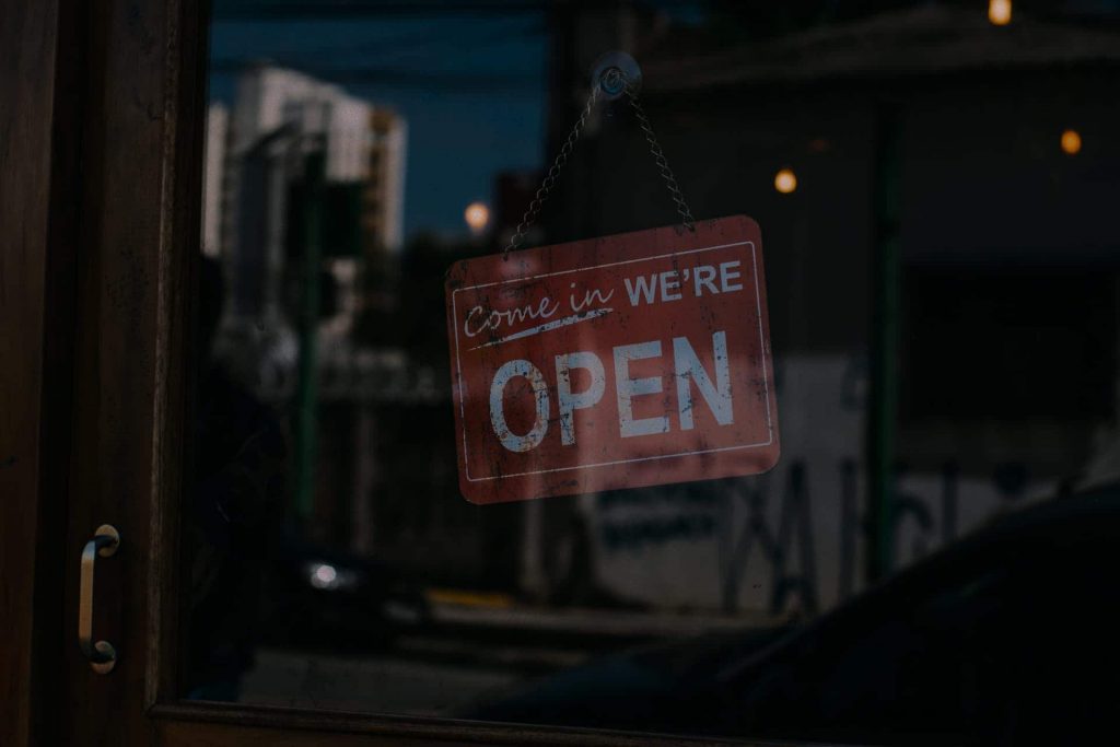 A photo of an open for business sign for the Unwanted Life Shop